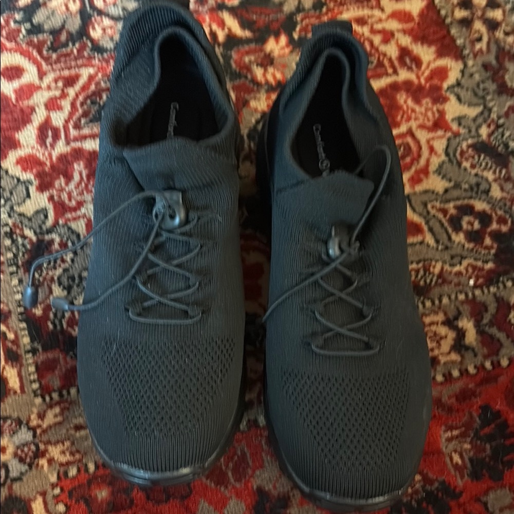 Black Streamlined Athletic Shoes with Breathable Design